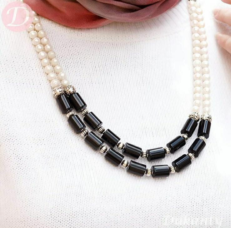 A necklace of black and white agate stones